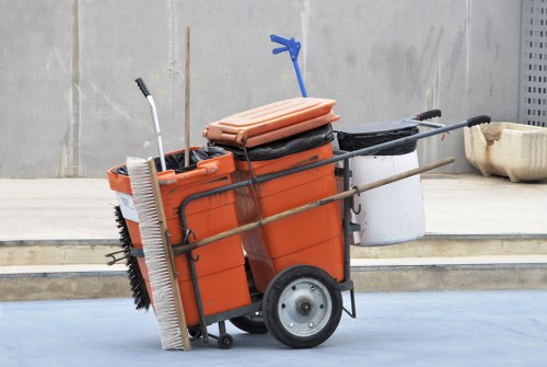 Operatives in high-visibility vests at a Whitechapel waste collection site